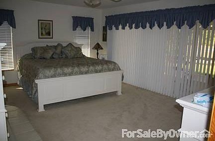 Master Bedroom
						:
						Doors open to screened lanai and beautiful backyard. Jacuzzi master tub. Carpet