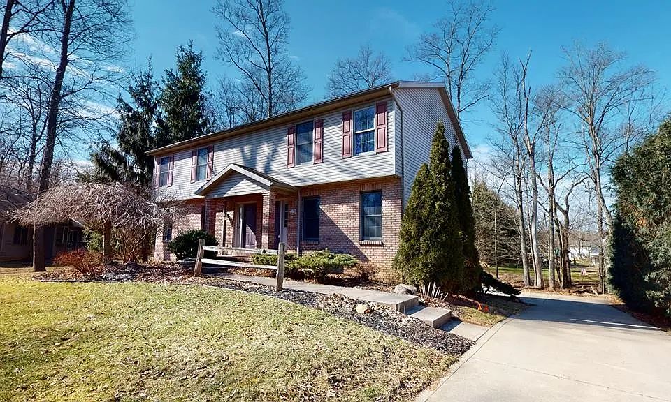 Front view of the house with view of the drive way - Unit on the right half