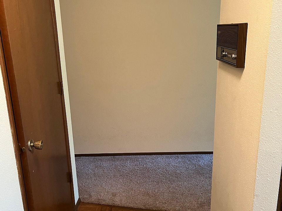 Entryway has radio installed in the wall across from the closet.