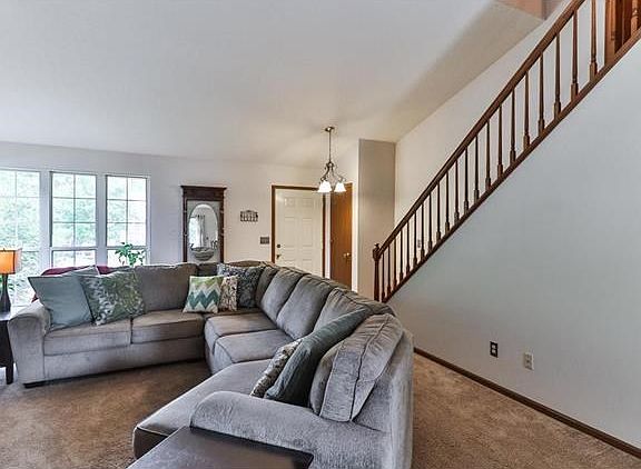 Lots of natural light and dramatic staircase leading to the second floor