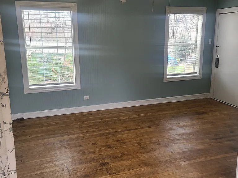 Living room from dining area. Front door to the right.