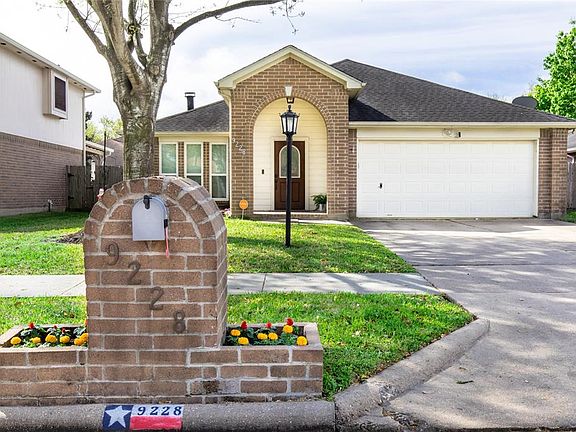 The front of the home has excellent curb appeal with a brick elevation and pretty landscaping.