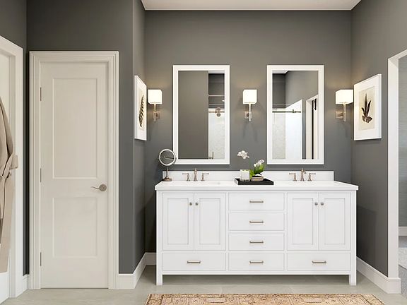 Primary bath with freestanding dual vanities