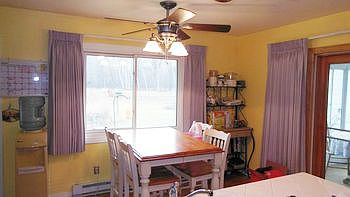 The eating area is wonderfully placed in front of the picture window to the back yard so you can watch the horses graze or the deer roam while enjoying your morning coffee.