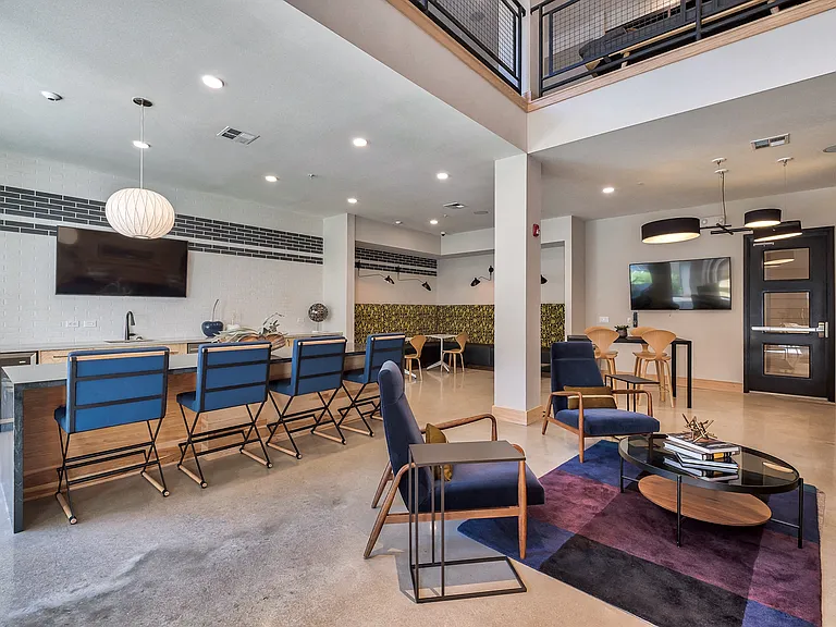 Expansive clubroom, featuring catering kitchen, library and game space