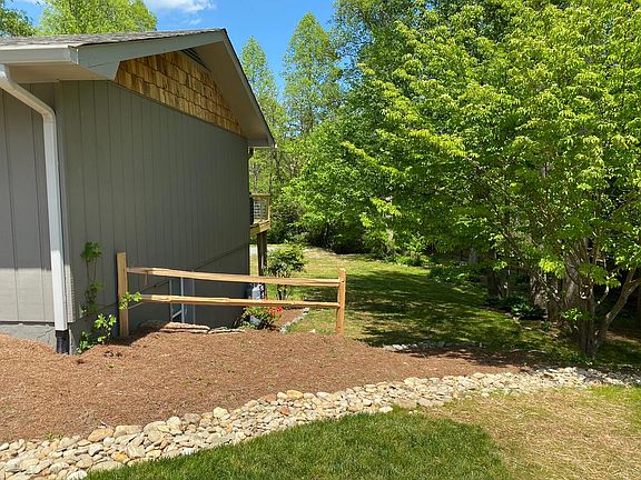 View of side and lower level of property