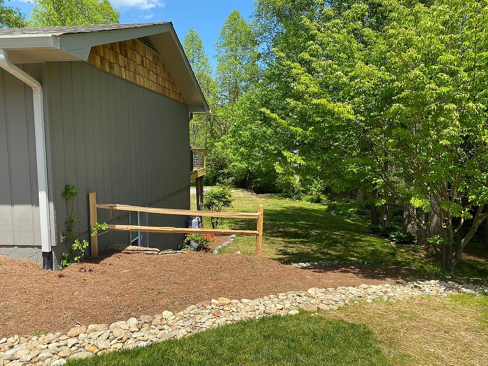 View of side and lower level of property