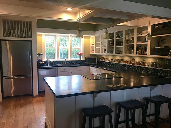 Kitchen with soapstone counters and upgraded appliances.
