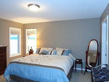 Master bedroom with a walk-in closet and an additional closet. Full bathroom off the master bedroom.