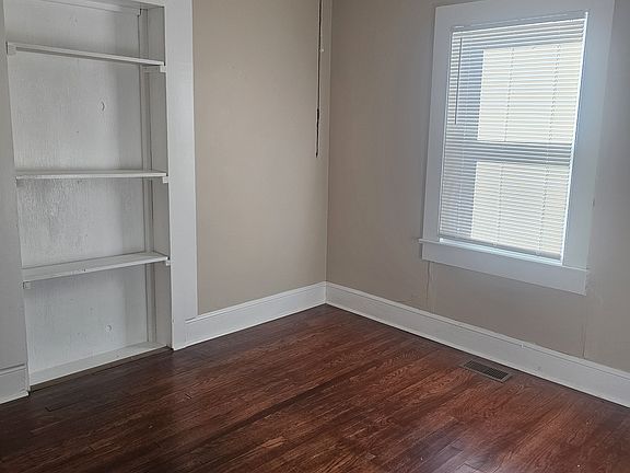 Bedroom with shelves.