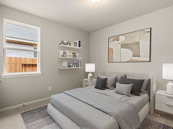 Third bedroom features plush carpet, neutral paint and a large window.