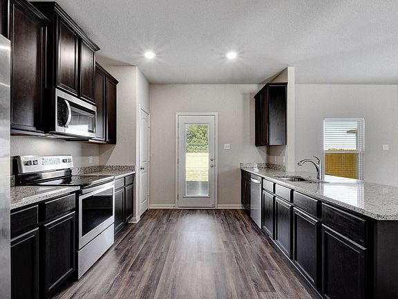 The kitchen comes with a full suite of stainless-steel appliances