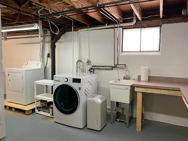 Laundry area with sink