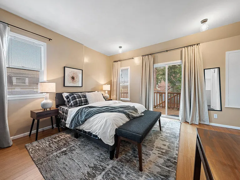 Bedroom 2 with sliding door to own deck and back entry