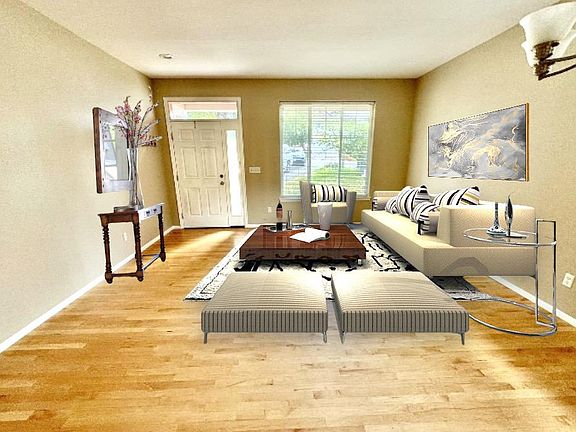 Depiction of Formal Living room with furniture. Furnishing is for suggestive purposes only. Is not included with home.