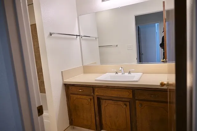 Front bathroom vanity with large, well-lighted mirror