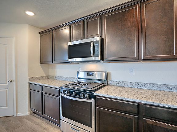 Incredible kitchen with stainless steel appliances and granite countertops.