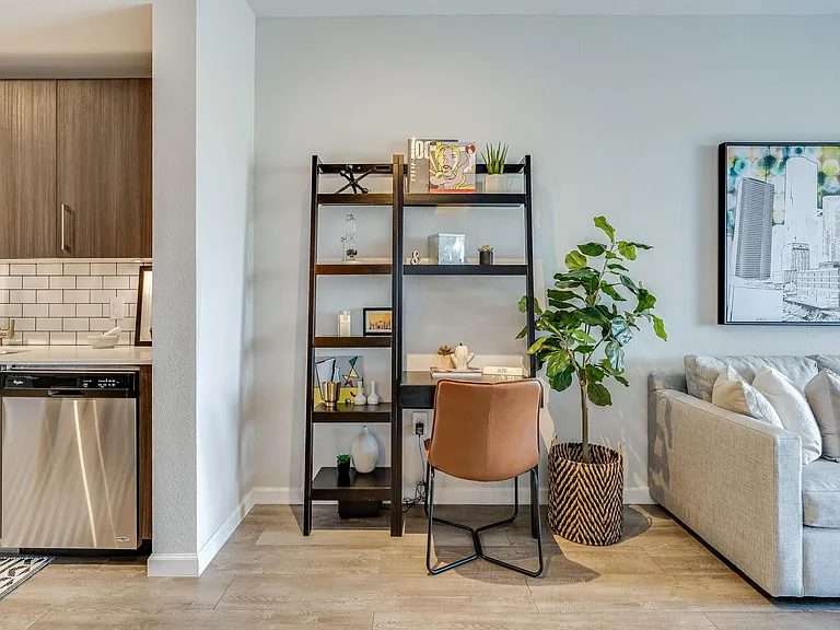 Living Room with In-Home Workspace with Bookshelves and Chair