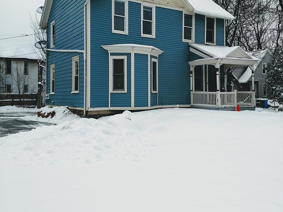 Front of house and lawn with private side and rear parking