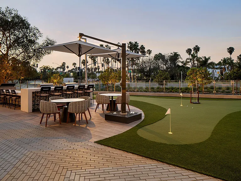 Outdoor gathering space with putting green