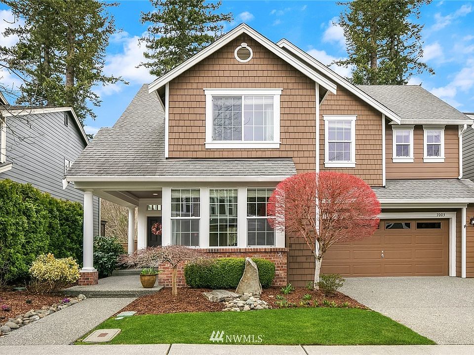 Meticulously cared for home and yard with a covered front porch. 