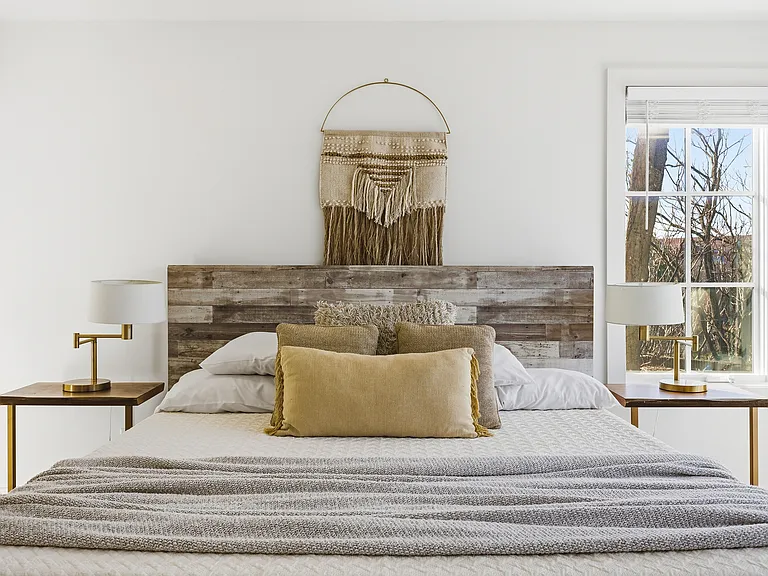 Bedroom 2 with a king bed and ensuite bath. Located on the 1st floor. Tastefully decorated with high-end modern furnishings and thoughtful touches to make your stay as comfortable as possible.