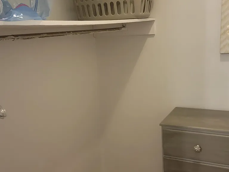 Upstairs bedroom walkin closet.
