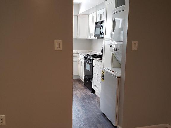 Laundry in kitchen with eas access to dining area