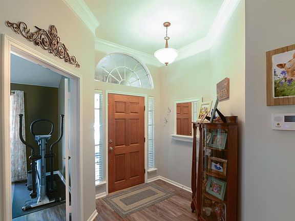 Come through your front door and notice these beautiful Vinyl Luxury Plank Flooring, and Crown Molding.