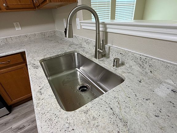 Heavy duty sink and solid Delta faucet.