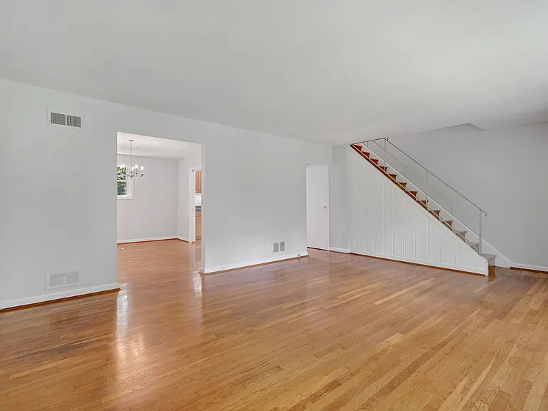 middle floor - living room - view of dining room and stairs leading to top floor