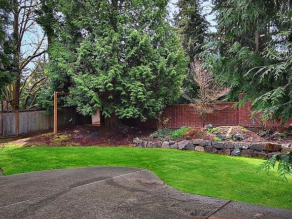 This nice flat, grassy backyard is perfect for a barbeque!
