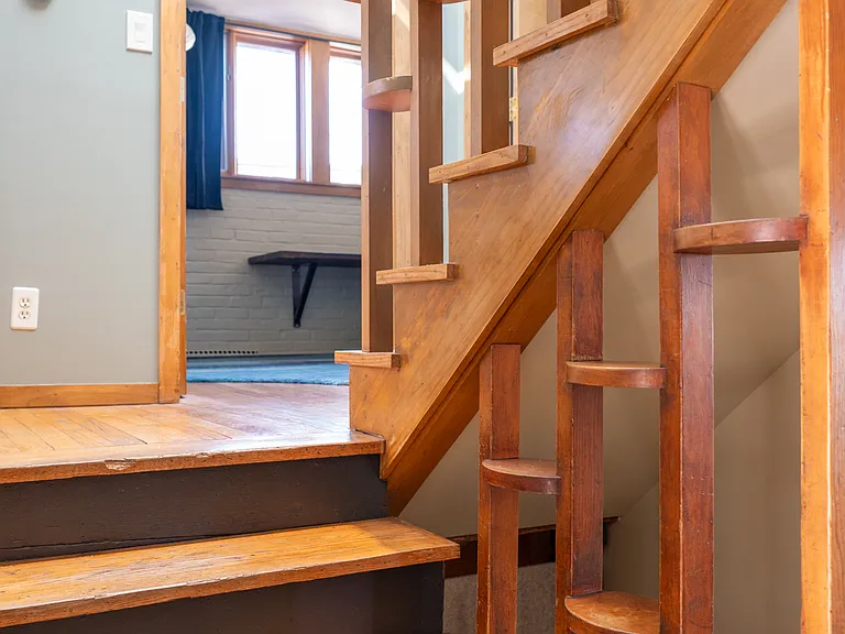 Stairs to second level with office, bedroom and bathroom.