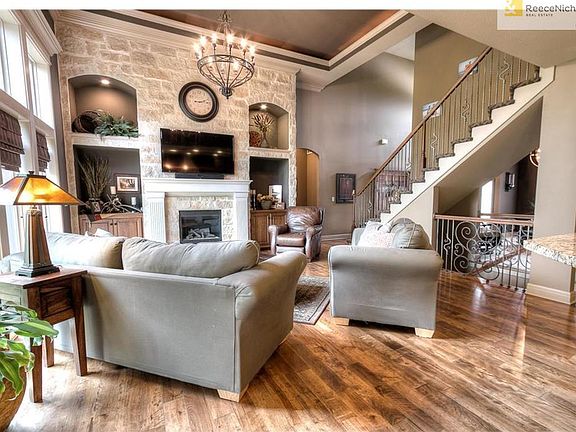 Great room features a wall of stone accents