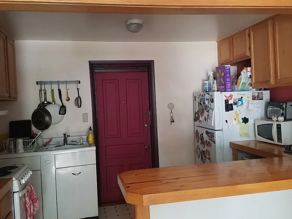 unit 2, 1 bedroom kitchen view, entrance door to unit