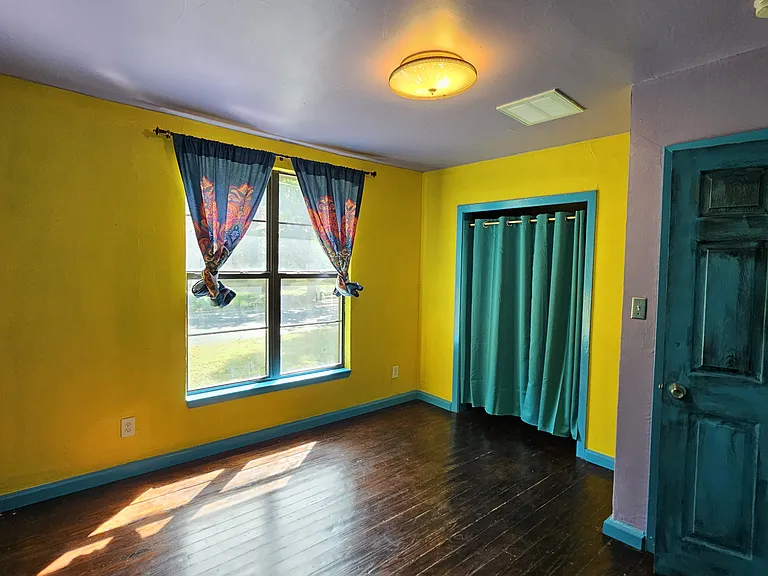 Third Bedroom down the hall with windows facing the front yard
