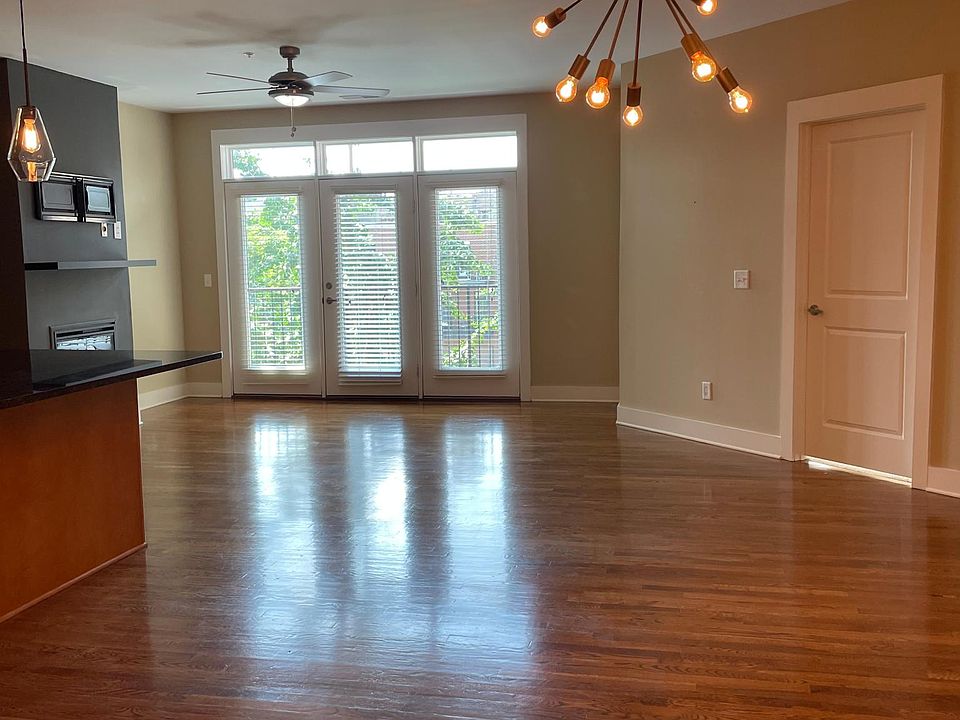 View into the unit from the door; open dining area, kitchen, and living area