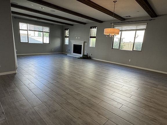 Open concept! View of the Living and Dining rooms, including the gas fireplace