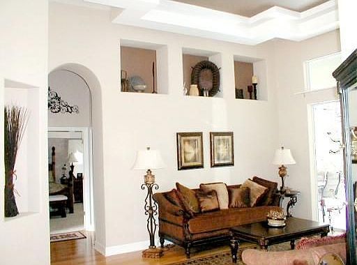 Architectual details like tray ceilings and niches adds charm.