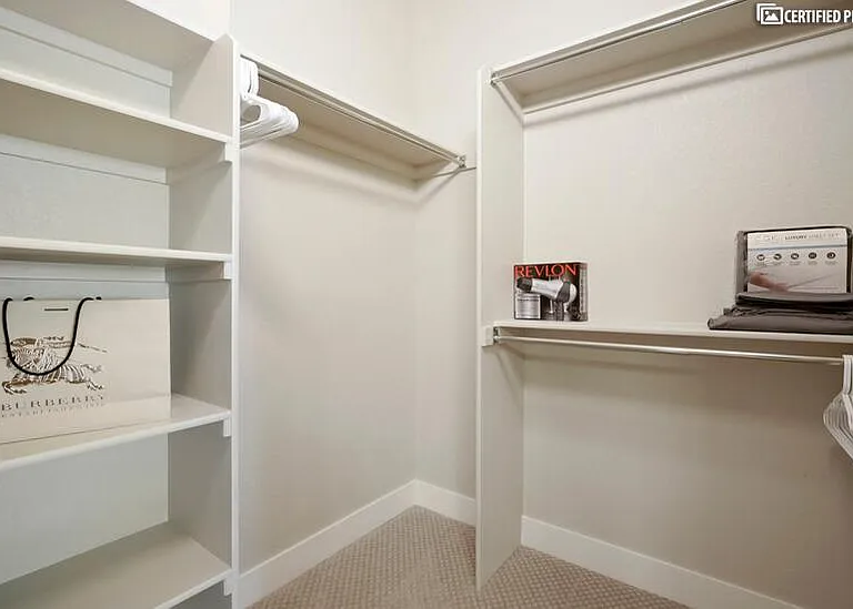 Luxurious walk-in closet in master suite