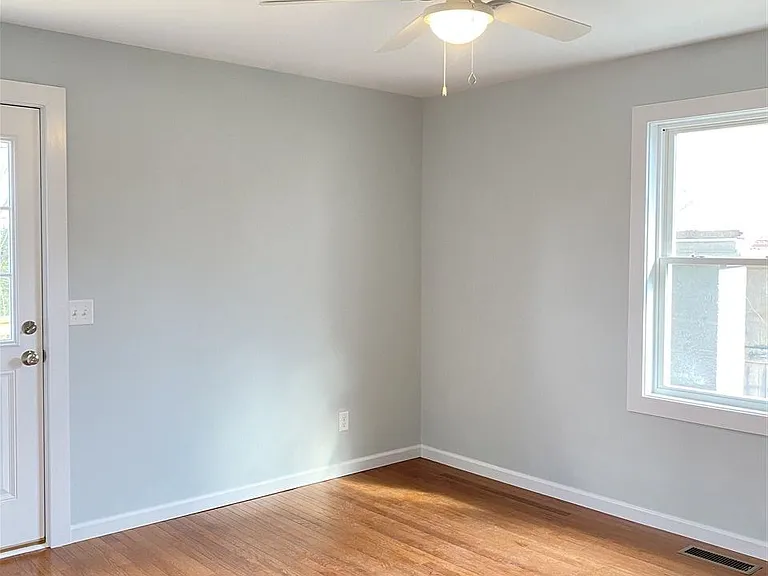 Bedroom #1 with door to back deck and yard