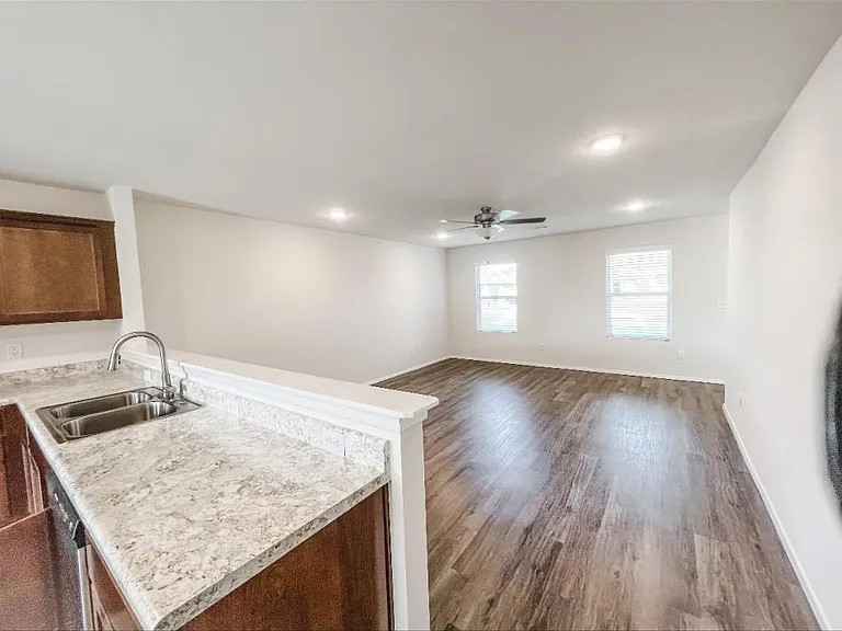 Open kitchen/living room and hard wood/laminate flooring!