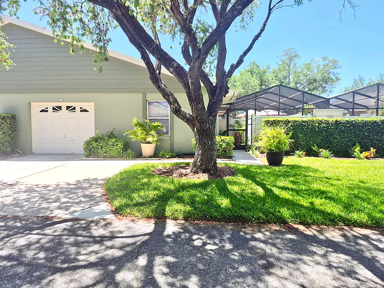 1 garage & 2 car outside parking. Gate on right.
