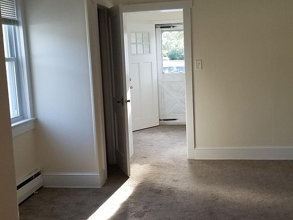 Large living room with coat closet