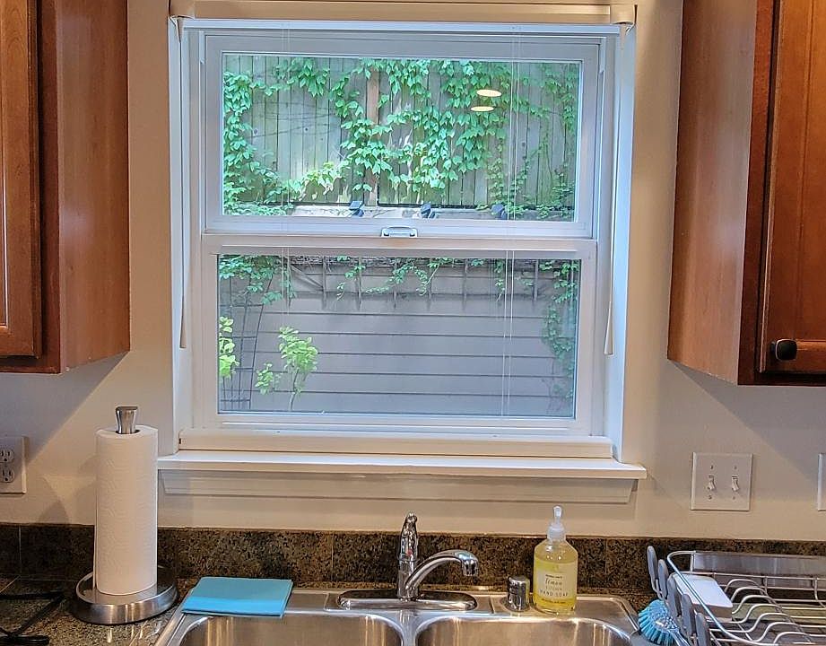 Large twin tub sink with insinkerator for easy clean up. Beautiful view of planter area and guests on the lanai.