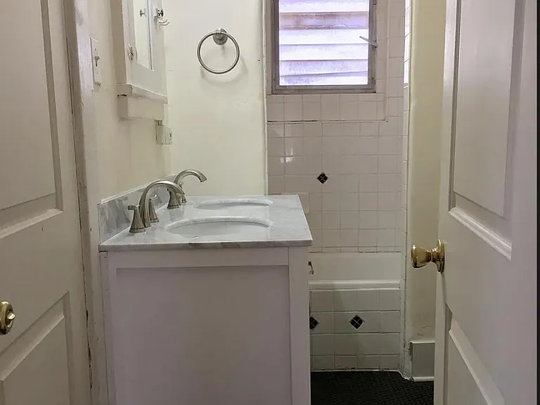 Double vanity with tub and shower in bathroom 1