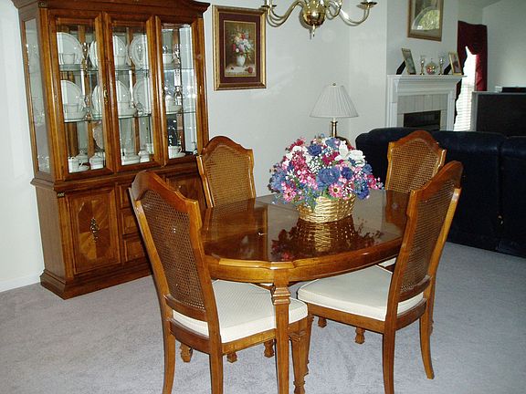 Dining Room with neutral carpeting and walls