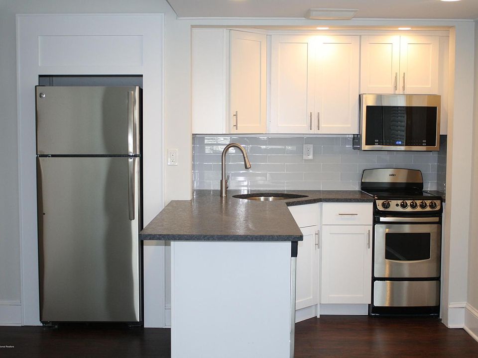 Kitchen with leathered granite countertop.