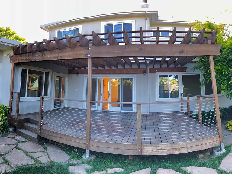 Large deck with pergola made from solid brazilian hardwood.