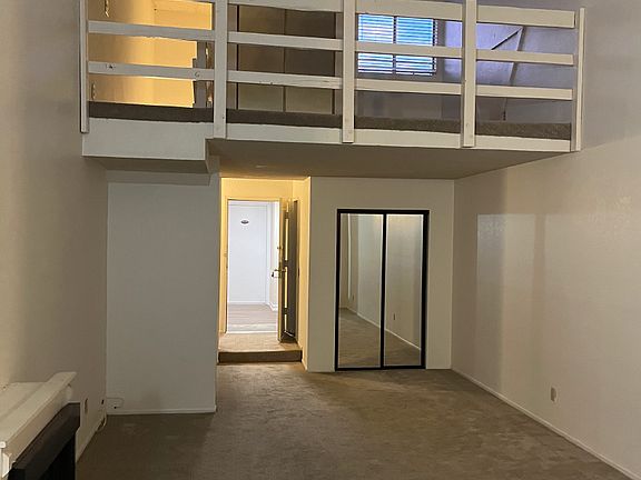 View from kitchen of main living area and loft/bedroom